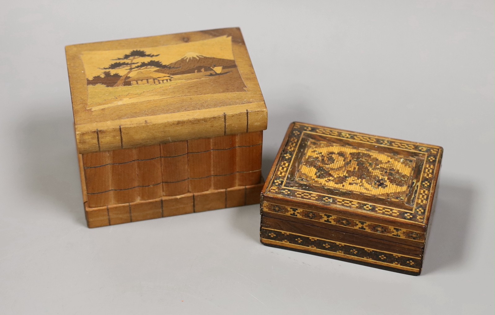 A 19th century Swiss oil on panel, a Tunbridgeware box and paperknife and other wood wares